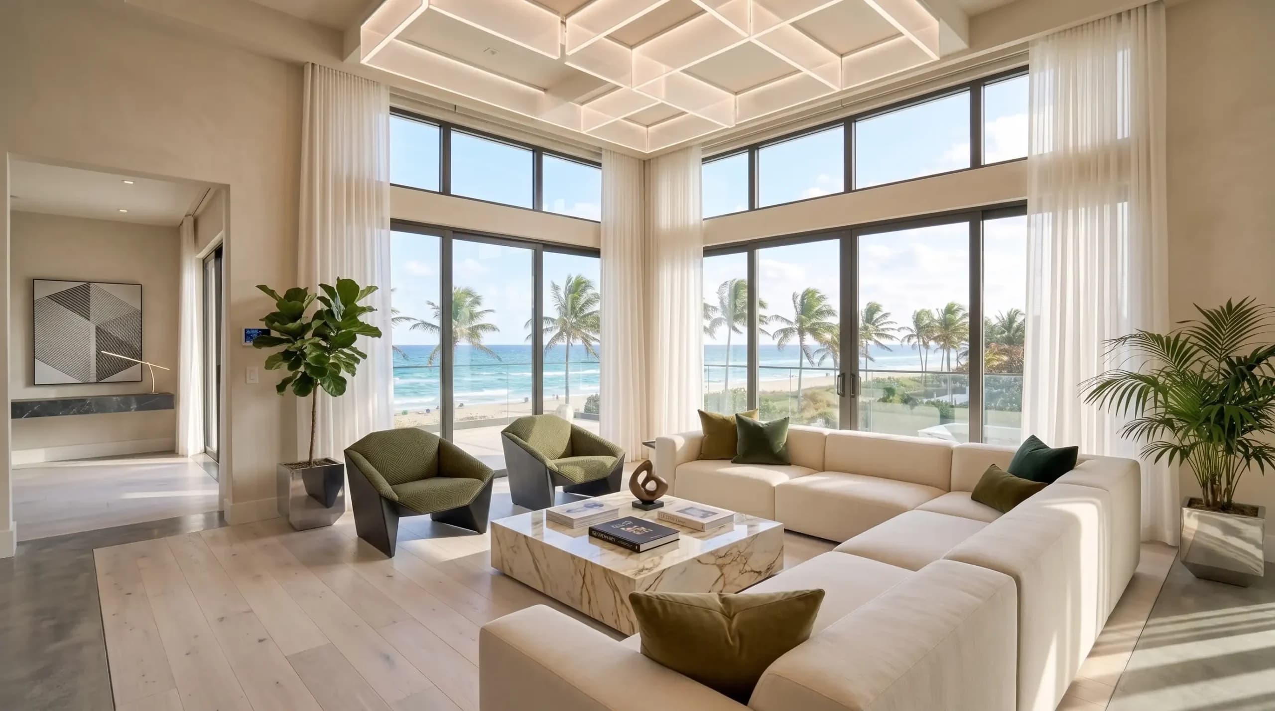 Modern luxury living room featuring floor-to-ceiling windows with ocean views, a cream sectional sofa, marble coffee table, geometric grid ceiling light, and potted tropical plants.