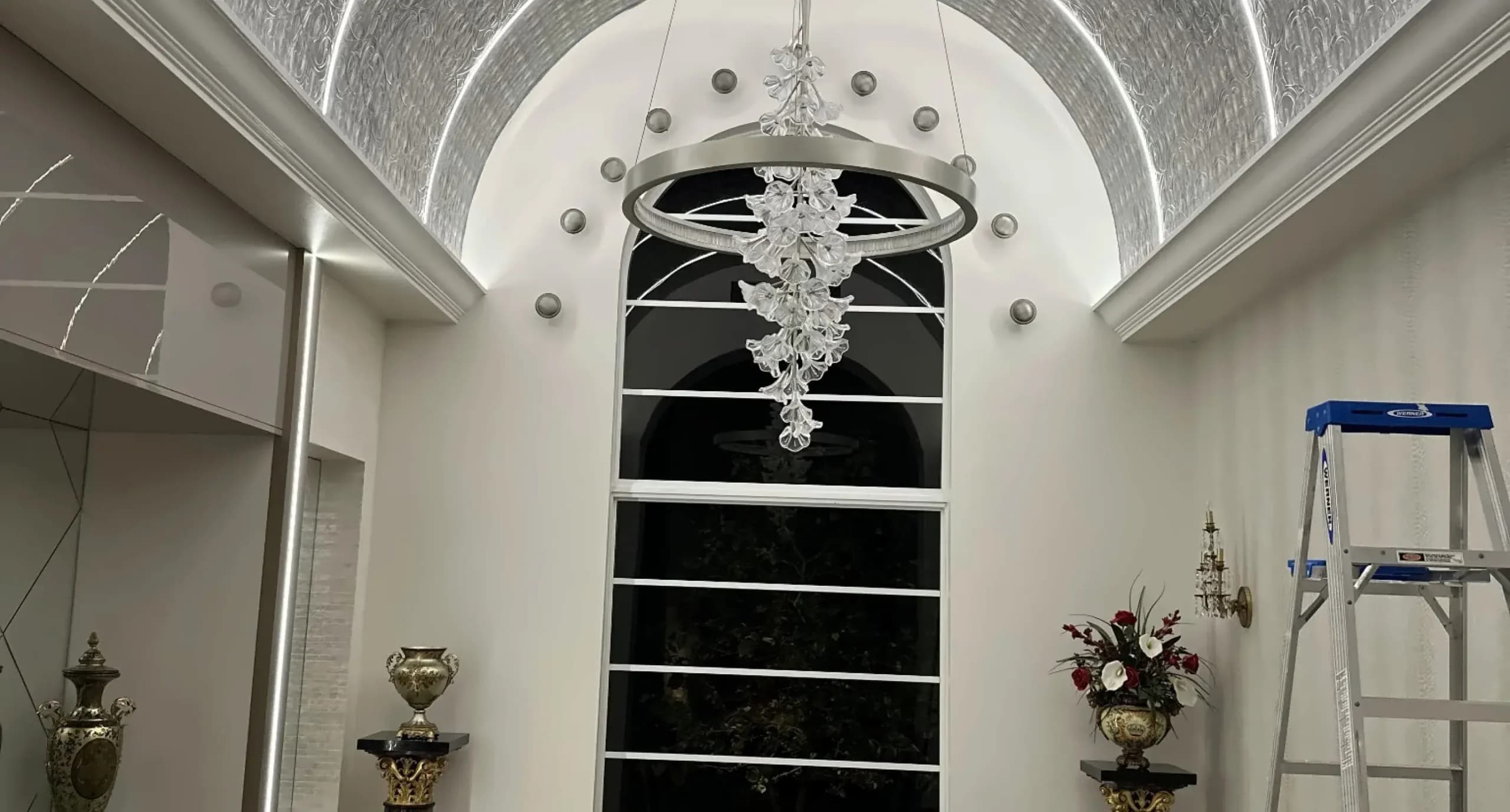 three-designers-reviewing-fabric-samples-arched-windows@2x